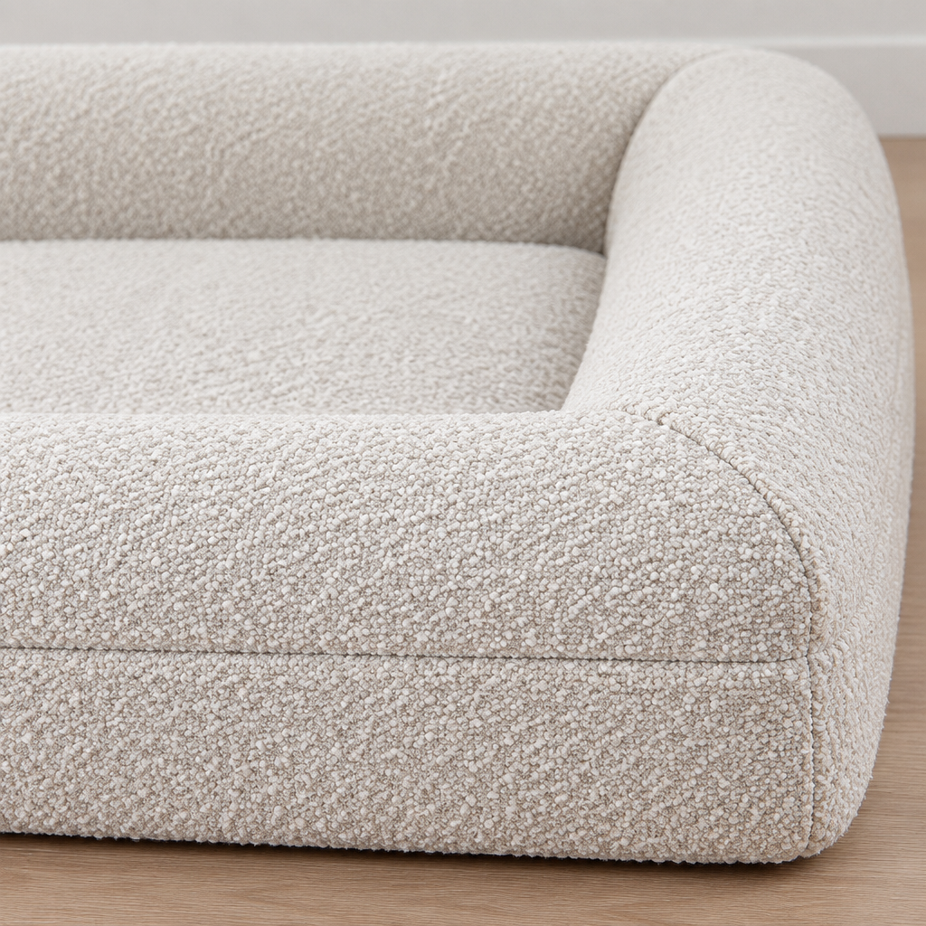 Close-up detail of the Memory Foam Dog Bed cover texture, stitching, raised edge, and cushion surface.