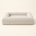 Memory Foam Dog Bed with waterproof removable washable cover on a soft cream background.
