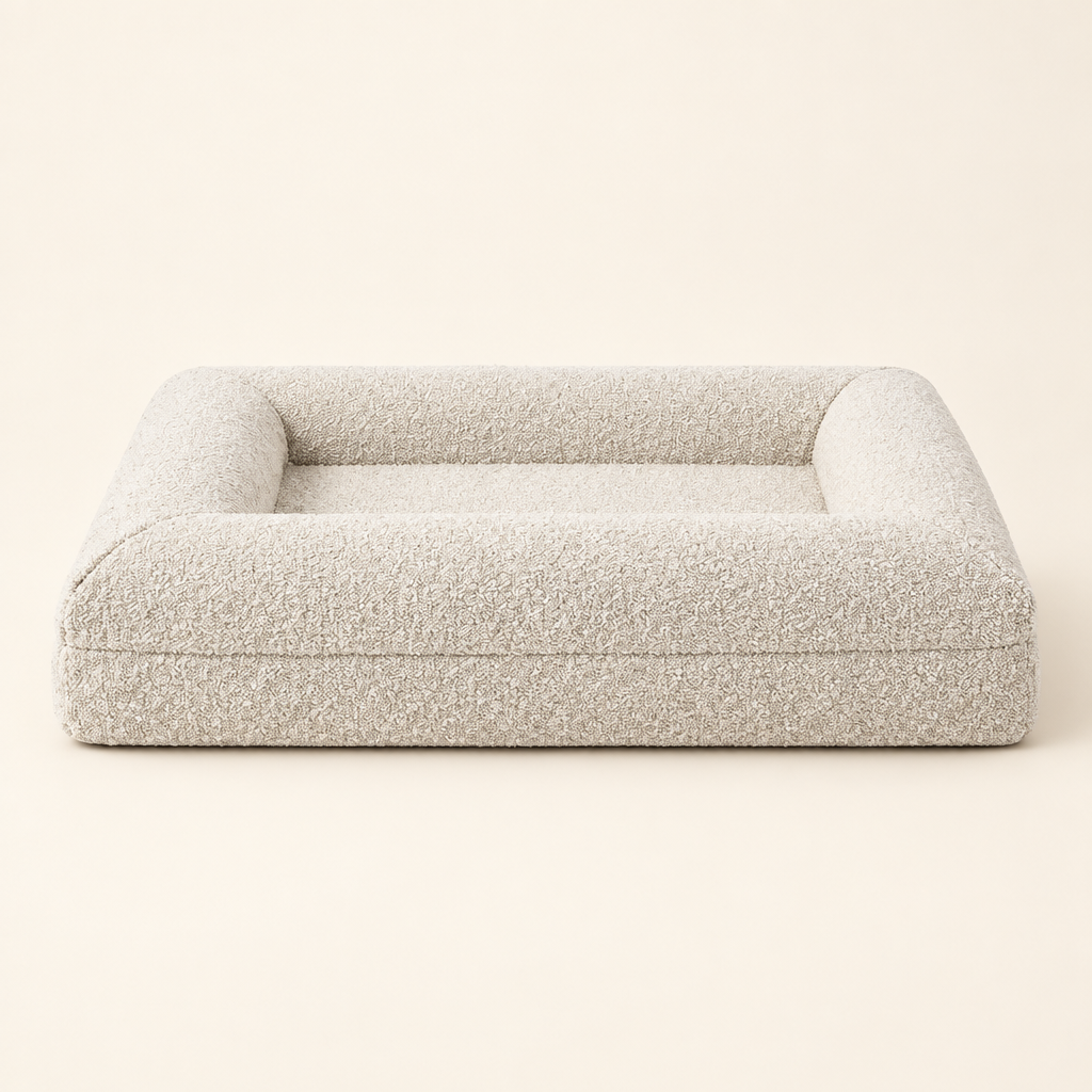 Memory Foam Dog Bed with waterproof removable washable cover on a soft cream background.